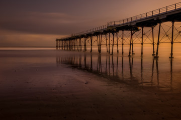Fototapeta na wymiar Sunrise under the pier at Saltburn by-the-sea in Yorkshire