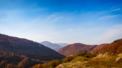 Scenic autumn landscape with mountain peaks