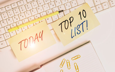 Conceptual hand writing showing Top 10 List. Concept meaning the ten most important or successful items in a particular list Empty orange square papers by the pc keyboard with copy space