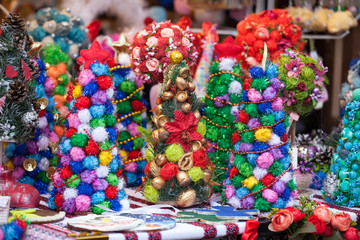 Mini Christmas Tree Table Decoration in a market. Small Pine Tree. Mini Xmas Gift.