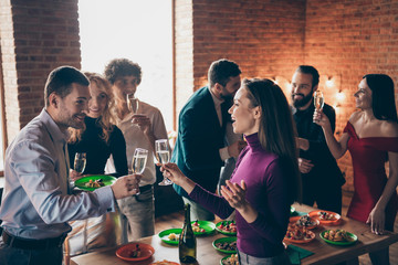 Portrait of nice attractive charming cheerful cheery glad guys meeting corporate event festal day tradition having fun together congrats at modern industrial brick wood loft style interior house