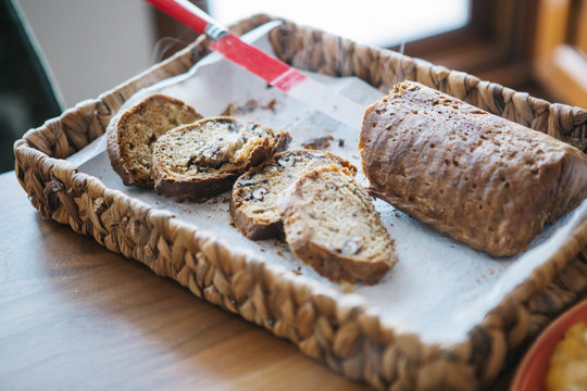 Sliced homemade gluten free bread on cutting board.