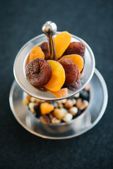 dried apricots and dried fruits on presentation plate