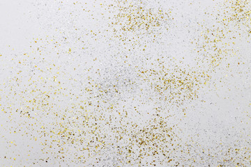 gold and silver color glitter on white paper texture background