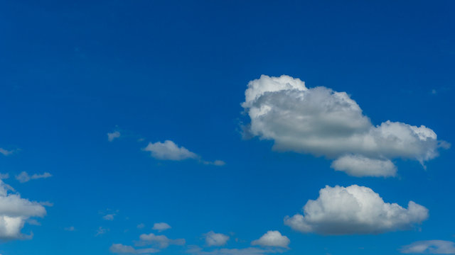 White clouds blue sky background. 