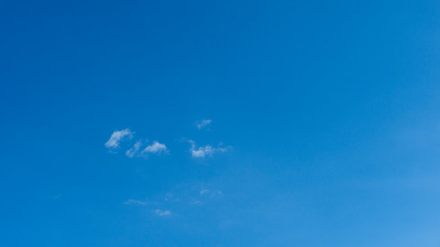 White clouds blue sky background. 
