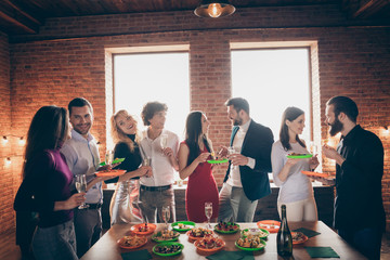 Portrait of nice attractive charming lovely cheerful cheery guy company enjoying meeting social life communicating having fun at modern industrial brick wood loft style interior house indoors