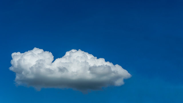 White clouds blue sky background. 