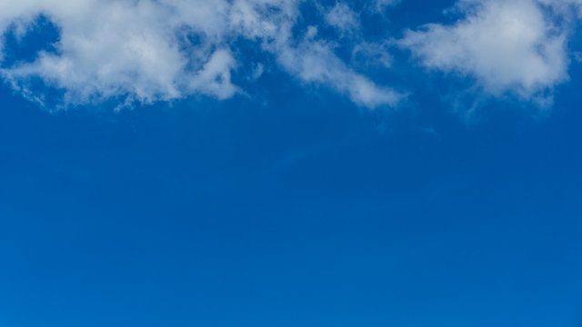 White clouds blue sky background. 