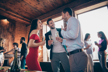 Low below angle view photo of positive company of people talking on free topics holding glasses with alcohol wearing formal clothing