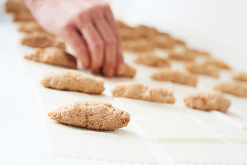 man preparing meat stuffed cannelloni