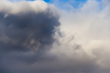 Beautiful thunderclouds. Fluffy volumetric clouds before a thunderstorm. Image without focus for design.