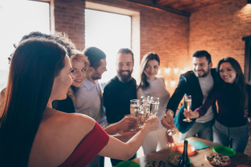 Photo of beautiful friendly company of corporate people enjoying being together at birthday party of their friend clinking glasses