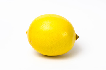 Ripe yellow lemon on a white background