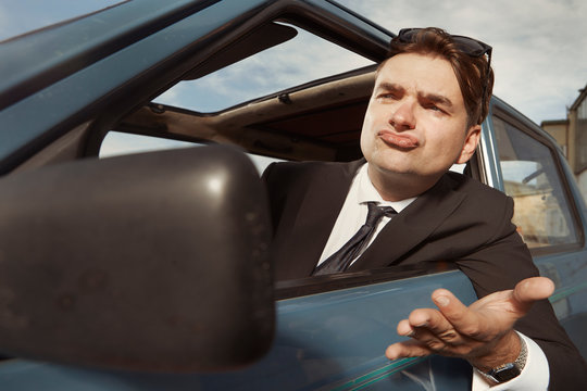 Man In Black Suit Driving His Lovely Retro Car