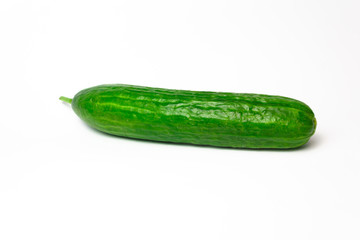 Ripe green long cucumber on a white background