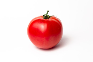 Ripe pink tomato on a white background