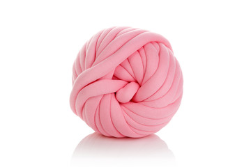 Ball of pink merino wool isolated on white background.