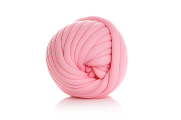Ball of pink merino wool isolated on white background.
