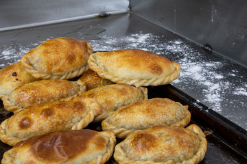 Empanadas argentinas cooling down at the table