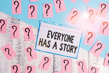 Writing note showing Everyone Has A Story. Business concept for Background storytelling telling your memories tales Scribbled and crumbling papers with thick cardboard above wooden table