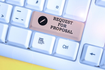 Text sign showing Request For Proposal. Business photo showcasing document contains bidding process by agency or company White pc keyboard with empty note paper above white background key copy space