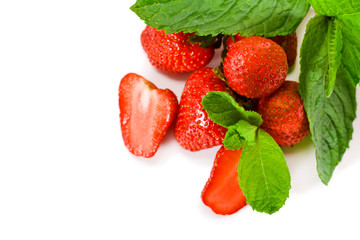Fresh mint and juicy strawberries isolated on a white background.