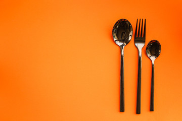 cutlery rustic, used for eating or serving (fork, knife, spoon, plate - set). food background. copy...