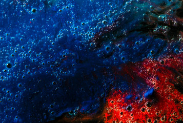 bubble abstract background with dish soap and red blue pigment colors