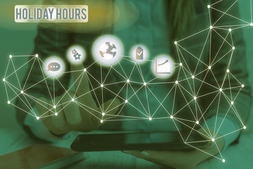 Handwriting text writing Holiday Hours. Conceptual photo employee receives twice their normal pay for all hours Picture photo system network scheme modern technology smart device