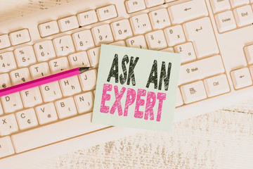 Writing note showing Ask An Expert. Business concept for consult someone who has skill about...