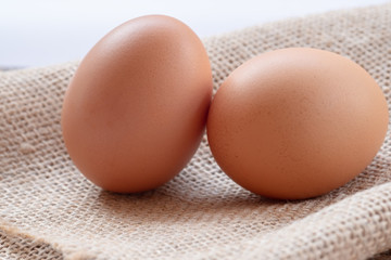 Close up chicken eggs with wooden background