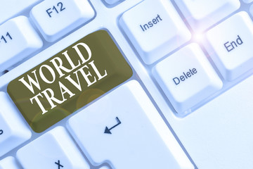 Text sign showing World Travel. Business photo text the movement of showing between distant geographical locations White pc keyboard with empty note paper above white background key copy space