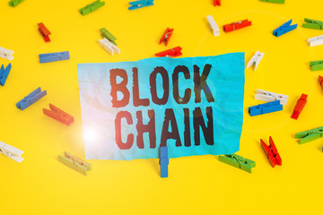 Conceptual hand writing showing Block Chain. Concept meaning system in which a record of transactions made in bitcoin Colored clothespin papers empty reminder yellow floor office
