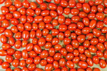 CHERY TOMATOES ON BOARDS ON WHITE BACKGROUND