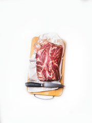 Raw pork meat isolated on white background with knife