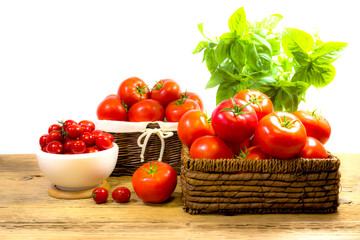 CHERY TOMATOES ON BOARDS WITH SPICES ON WHITE BACKGROUND