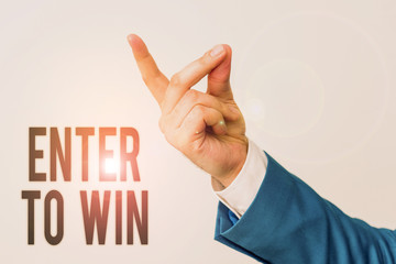 Handwriting text Enter To Win. Conceptual photo exchanging something value for prize or chance of winning Isolated hand pointing with finger. Business concept pointing finger