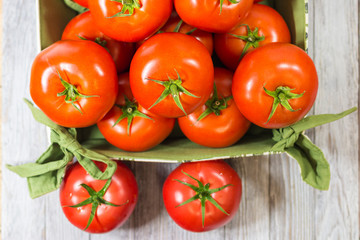 CHERY TOMATOES ON BOARDS WITH SPICES ON WHITE BACKGROUND