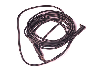 Coil of black wire with connectors isolated on white background