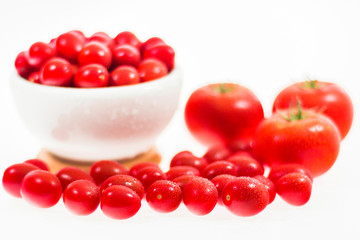 chery tomatoes on a white background with spices