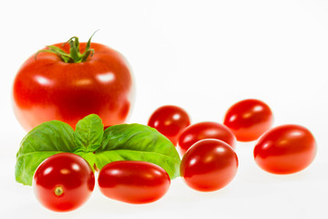 chery tomatoes on a white background with spices