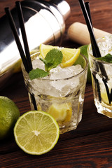 Lemon Fruit Lime Caipirinha of Brazil. Cocktail with lemon and mint