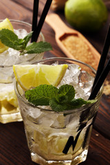 Lemon Fruit Lime Caipirinha of Brazil. Cocktail with lemon and mint