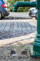 Fototapeta na wymiar public water fountain in the streets of Berlin
