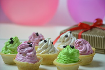 Children's birthday. Table decorations, balloons, treats, juice and gifts. A lot of colorful balloons prepared for a child`s birthday party that will surely end up exploding. Synonym of fun and joy.