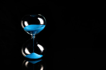 blue retro hourglass to measure time