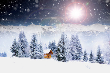 Naklejka premium Wooden cottage in a fairy-tale winter landscape.