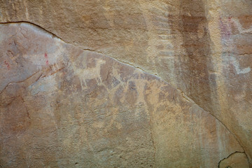Detail of a part of the petroglyphs incised by the Fremont People in the sandstone rock face at...