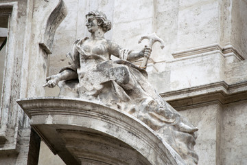 Fototapeta na wymiar Angel on facade of San Marcello al Corso church in Rome, Italy